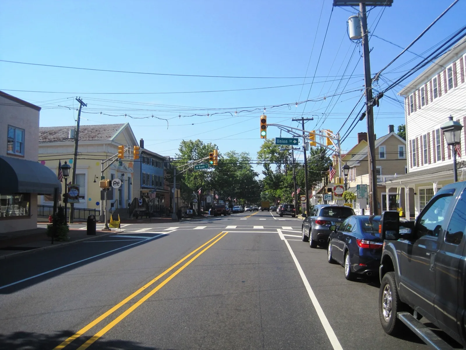 Main Street in downtown Medford, with shops and older homes on both sides