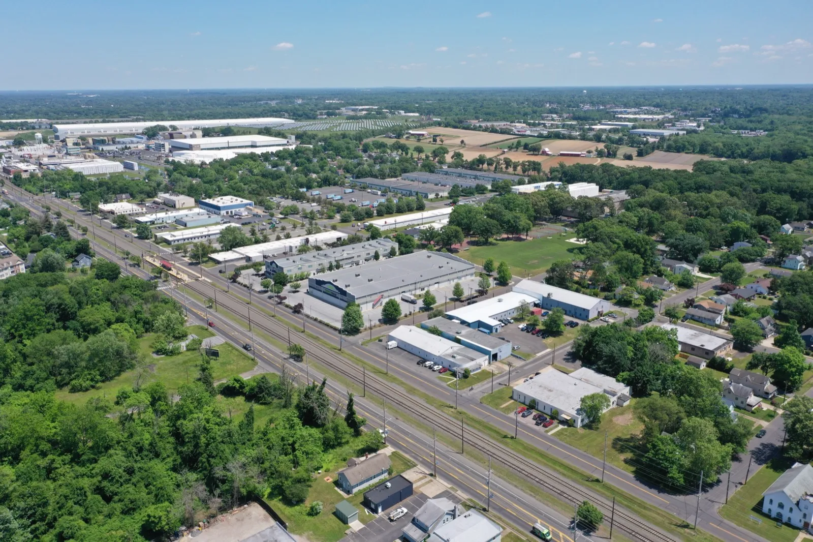 Low-rise commercial buildings and parking lots along a South Jersey highway, seen from the air
